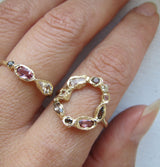 Marina phoenix Ring with morganite, pink tourmaline and smoky quartz on woman's hand.