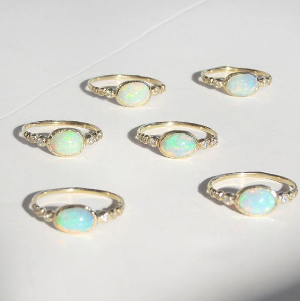 Six 14K Freshwater Opal Rings on Table.