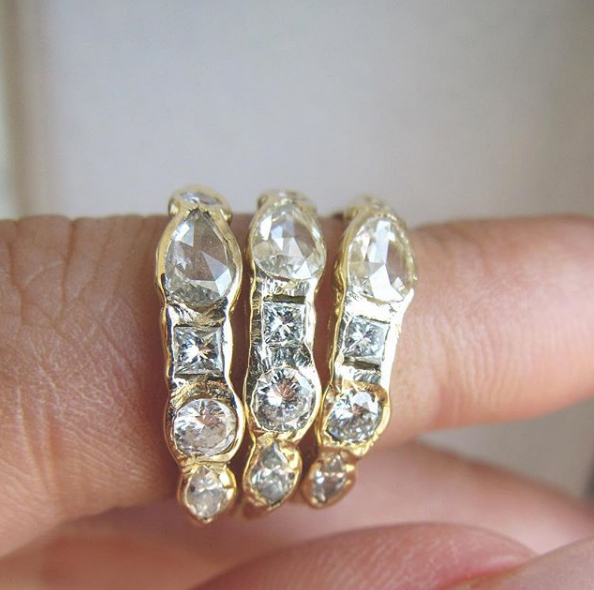 Three 14K Journey Treasure Diamond Rings on Woman's Finger.