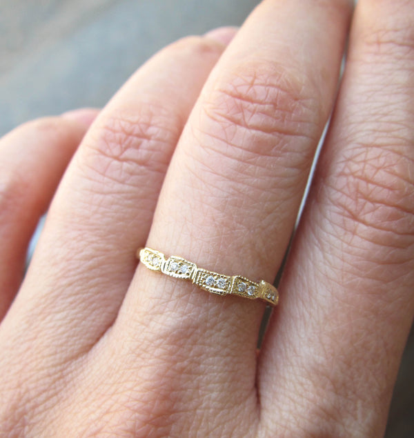 Scenic 3mm Diamond Ring with White Round Brilliant Diamonds on Woman's Hand.