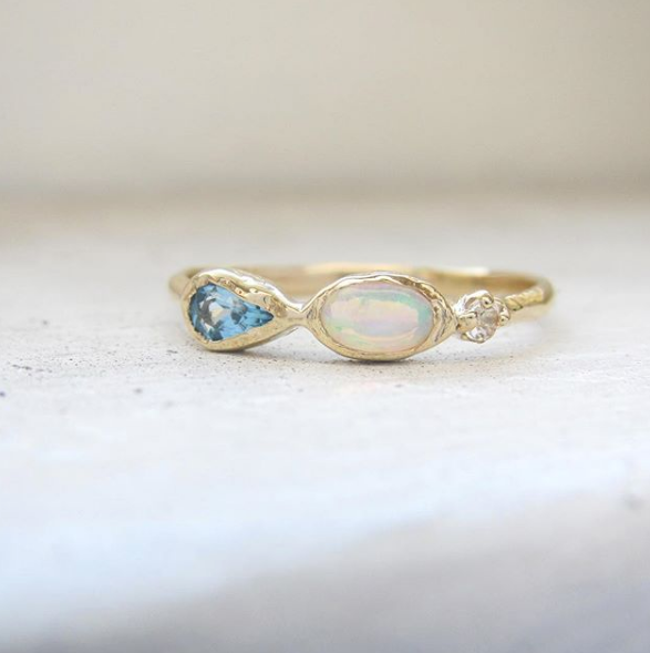 Marina mermaid ring with blue topaz, opal and aquamarine front view.