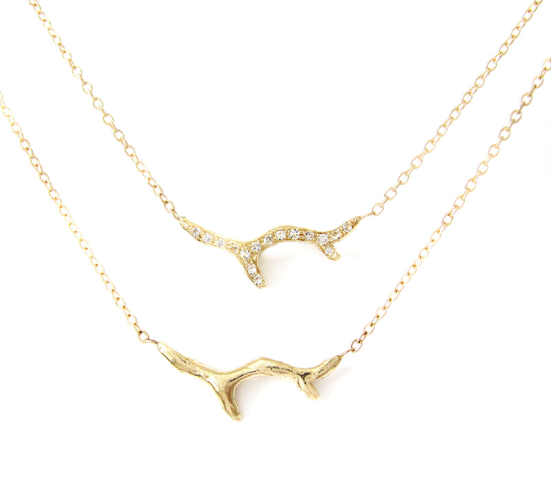 2 14k Yellow gold Branch Necklaces hanging.