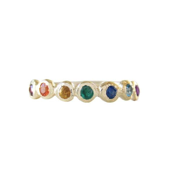 Tauri rainbow ring made with red garnet, orange sapphire, citrine, emerald, blue sapphire, blue topaz and amethyst.
