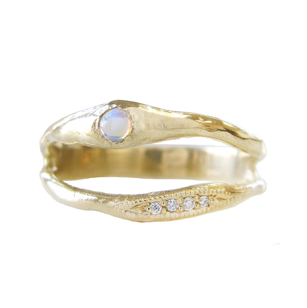 Oceana opal ring with white round brilliant diamonds.