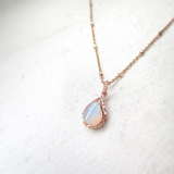 Raindrop Opal Necklace hanging. 