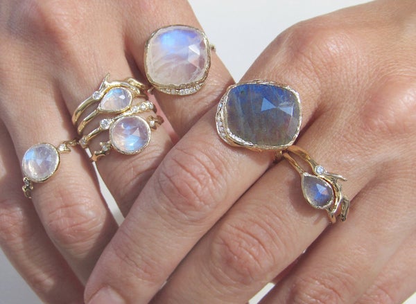 Handcrafted morganite rings on model's hands