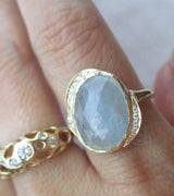 Handcrafted 14K yellow gold rose cut aquamarine and diamond ring on the hand