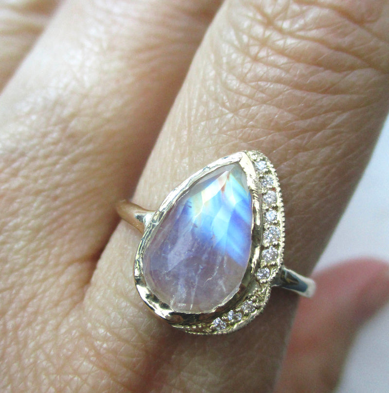 14K yellow gold one of a kind Big Raindrop Moonstone Ring on the hand