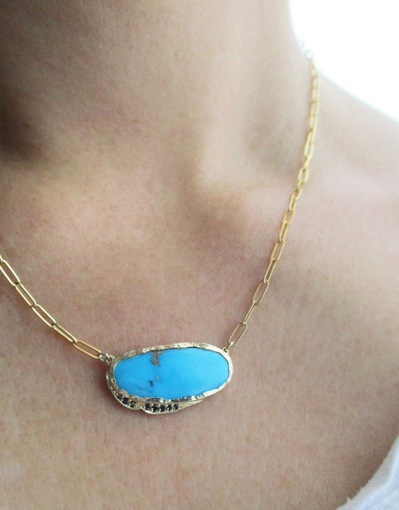 14K yellow gold turquoise necklace with black diamonds on the neck Kingman Turquoise