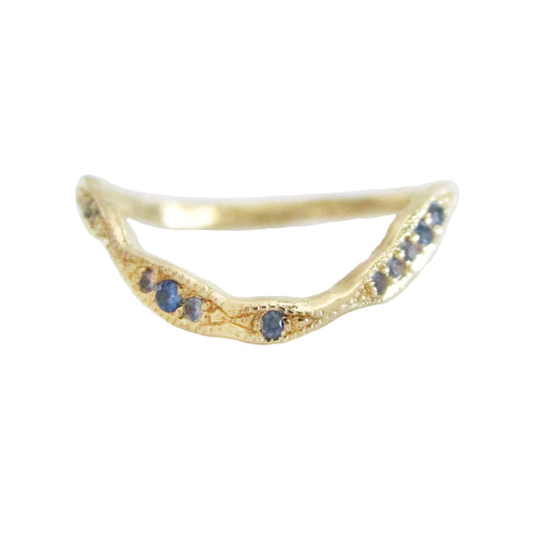 14K gold curved stacking ring with blue sapphires on white background