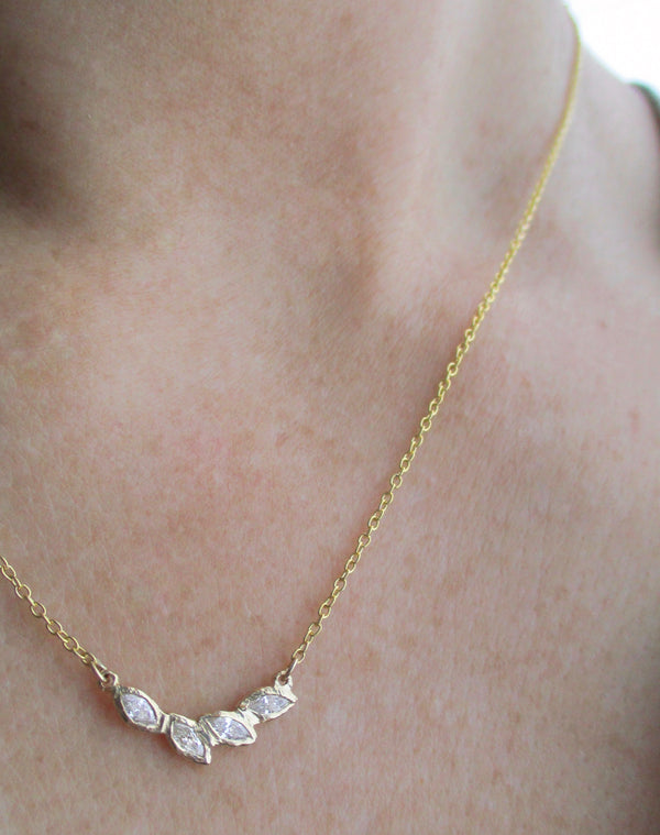 14K gold marquis diamond necklace on the neck