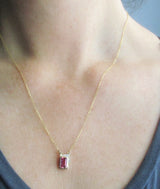 14K gold pink tourmaline necklace with diamonds on the neck