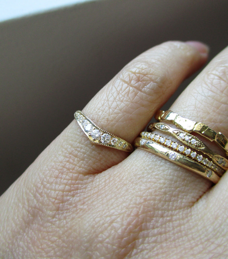 14k Gold vega diamond ring with eight white round brilliant diamonds.