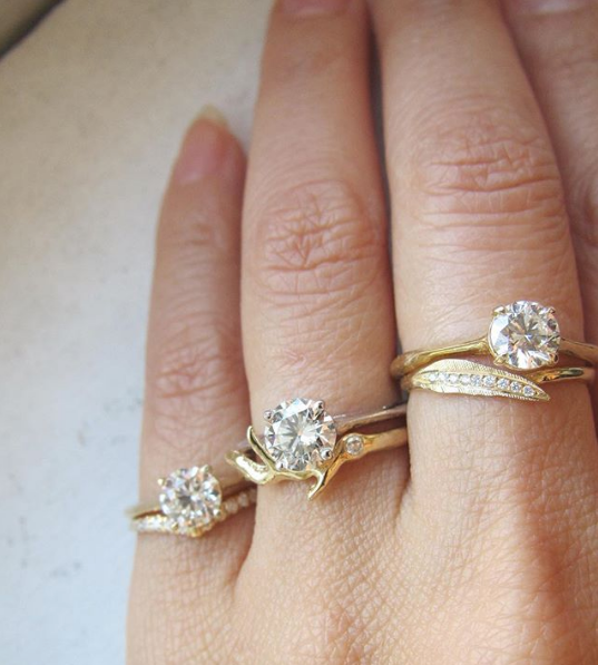 3 Sets of gold diamond rings on hand.