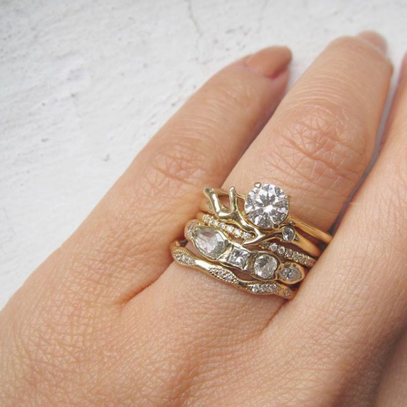 Gold diamond rings on index finger.