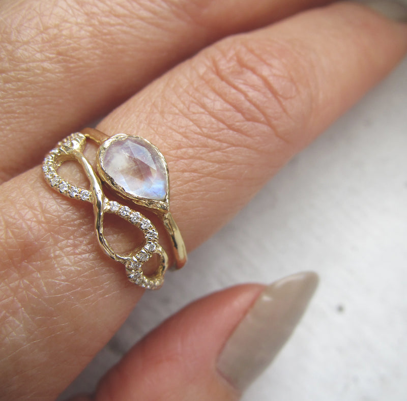 14K Yellow Gold Nami Ring on Woman's Hand.