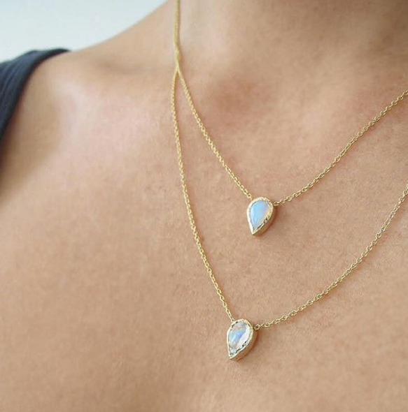 2 14K Compass necklaces with opal on woman's neck.