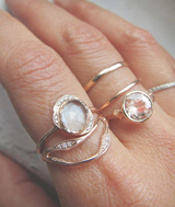 Double Tide Ring with White Round Brilliant Diamonds Top View on Woman's Hand.