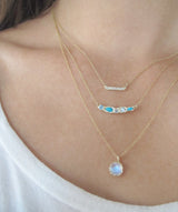 14K Fire Coral Moonstone Necklace combined on woman's neck.