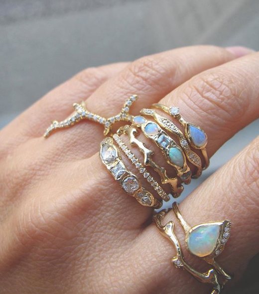 Yellow Gold Fire Coral Rings on woman's hand.