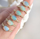 Six 14K Freshwater Opal Rings on Woman's Hand.