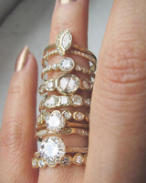 Many 14K Yellow Gold Journey Rosecut Diamond Rings on Woman's Hand.