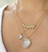 14K Yellow Gold Lei Necklace and Two Other Moonstone necklaces on Woman's Neck