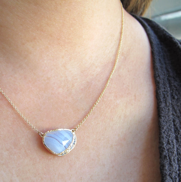 14k Blue lace agate hidden cove necklace with a strip of round brilliant sapphires.