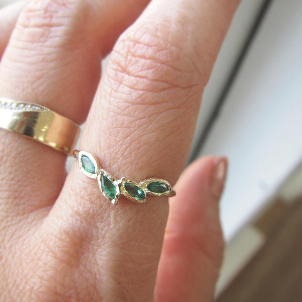 14k Petal emerald ring on woman's hand. 