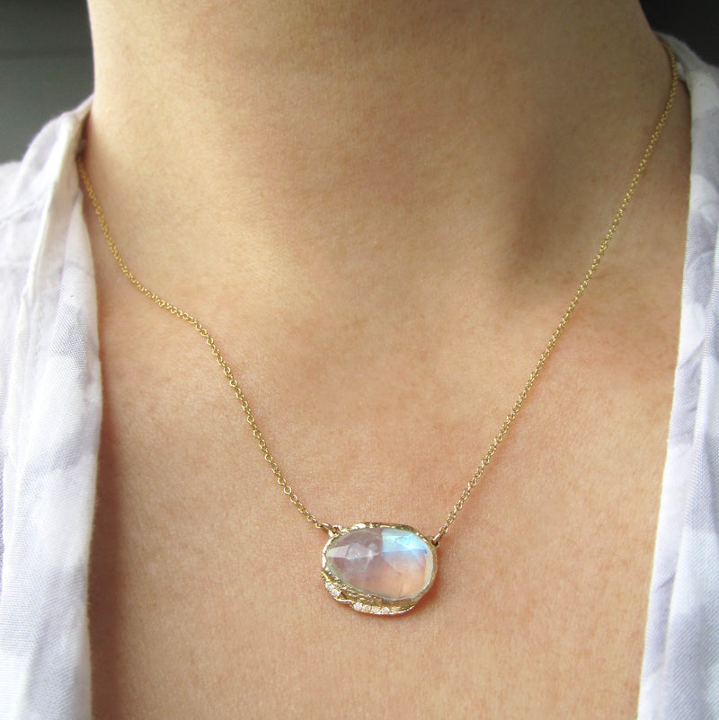14K Gold blue moonstone hidden cove necklace on woman's neck.