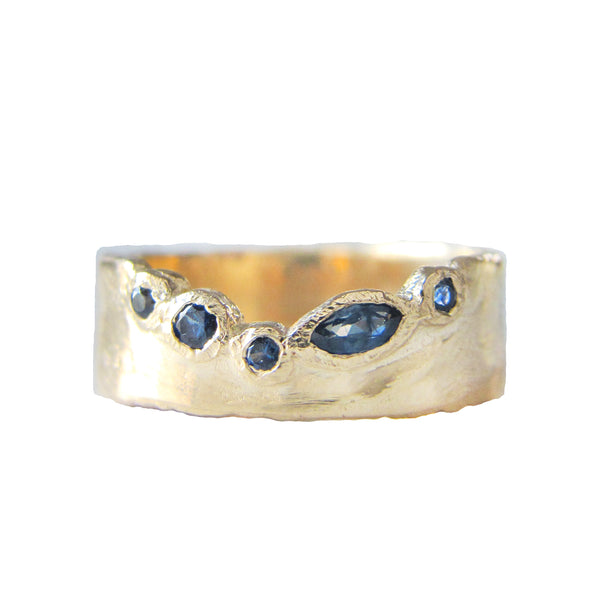 Passage sapphire ring with round brilliants.