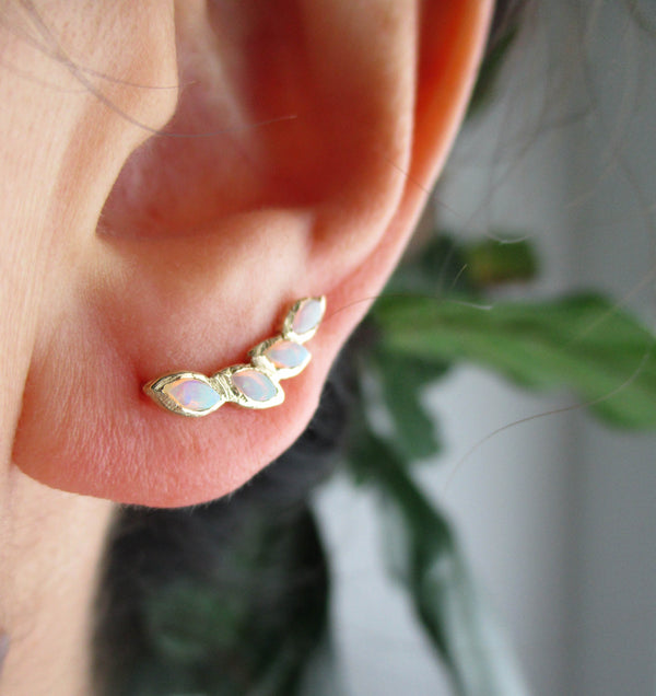 Petal Opal Ear Crawler on Woman's Ear. 