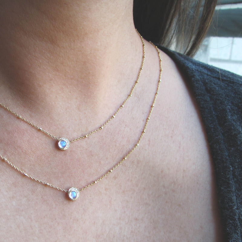 Baby moon necklace with rainbow moonstone and white round brilliant diamonds.