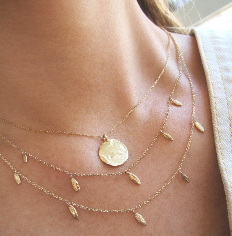 14k Yellow Gold Hula Necklace combined with two more necklaces.