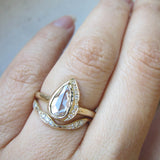 Pear-shaped Raindrop Rosecut Diamond Ring on Woman's Hand. 