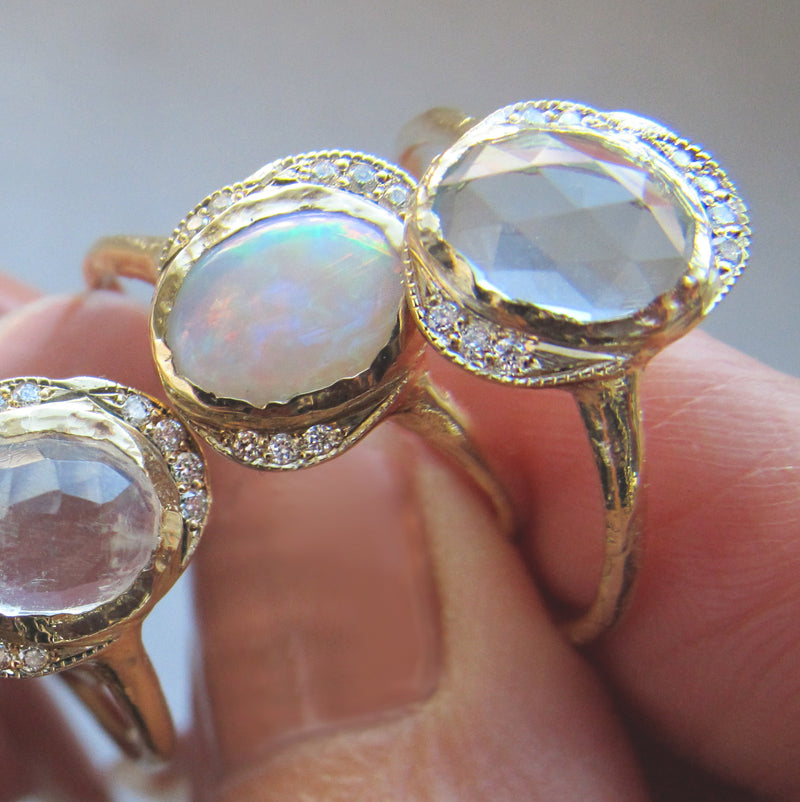 Three 14K Oasis Blue Topaz Ring with White Round Brilliant Diamonds.