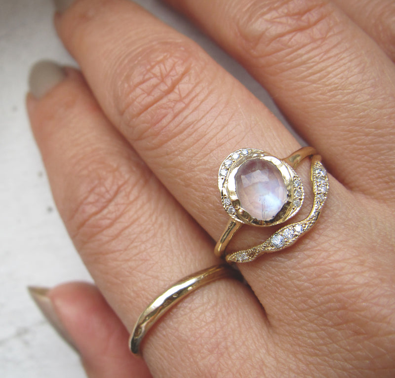 Oasis Moonstone Ring with White round brilliant diamonds on Woman's Hand.
