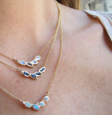 14k Yellow Gold Petal Opal Necklace on Woman's Neck as a set of Three.