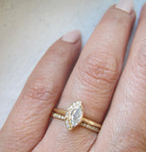 Petite Native Diamond Ring with White Round Brilliant Diamonds on Woman's Hand.