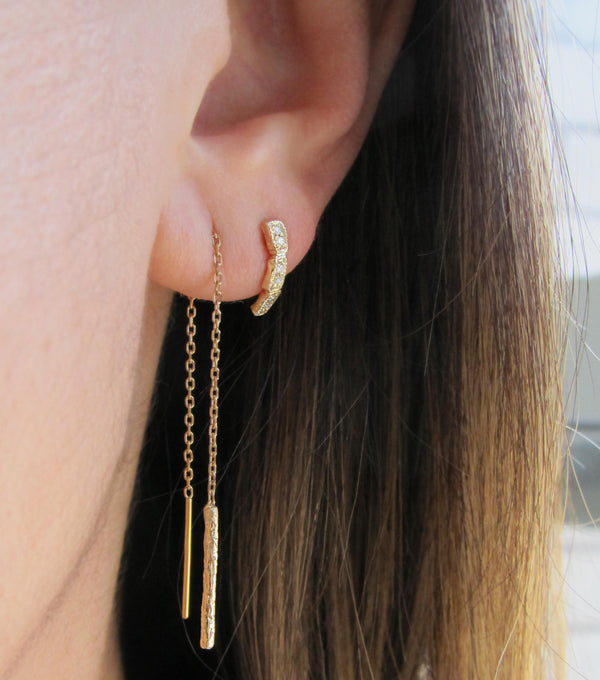 Scenic Gold Ear Threader on Woman's ear.