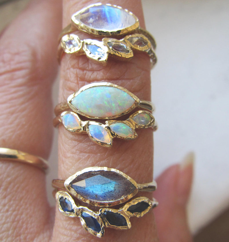 Tribe Moonstone Ring with Rosecut Rainbow Moonstone on Woman's Hand.