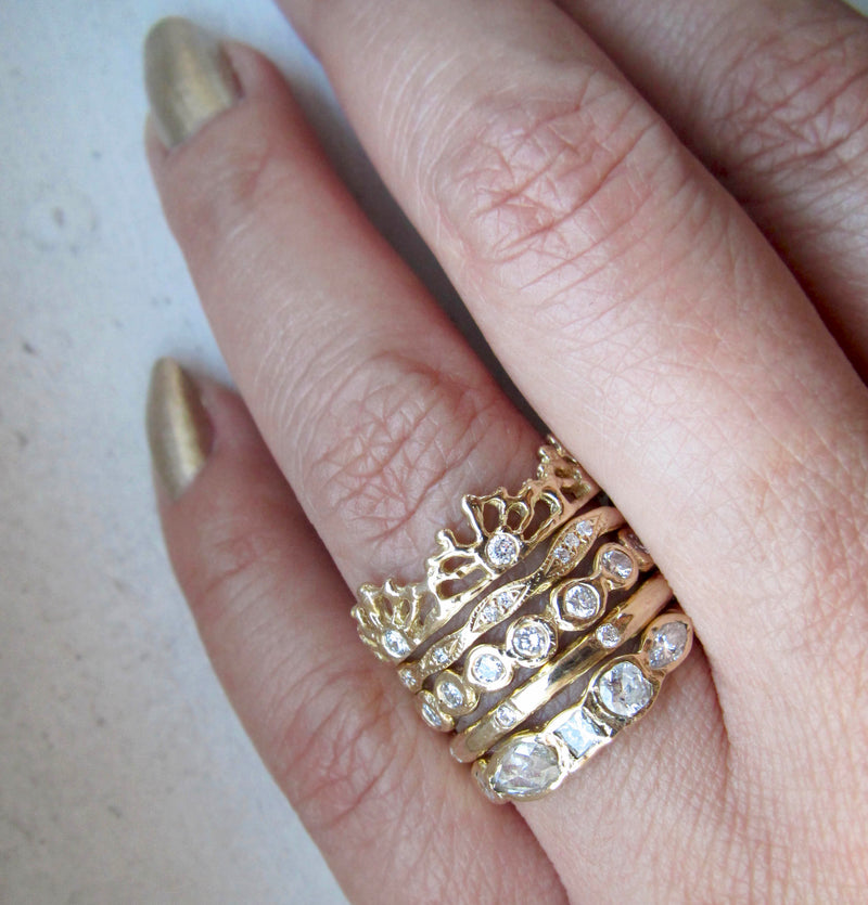 Gold Triple Crown Ring combined with 4 extra gold rings. 