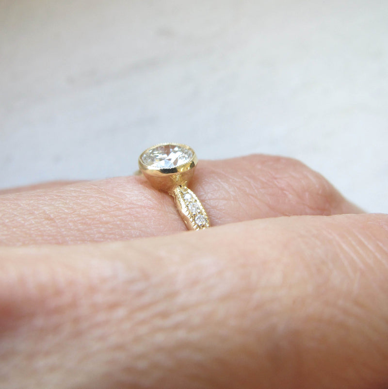 14k Wave Solitaire Ring on Woman's Hand as Side View. 