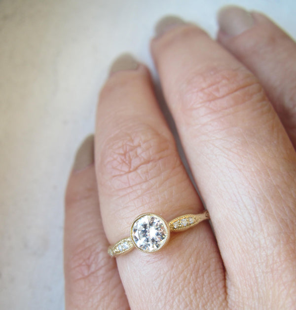 14k Wave Solitaire Ring on Woman's Hand. 