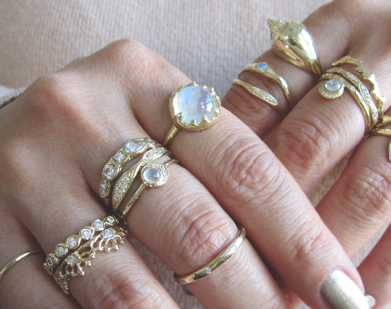 Gold ring sets on woman's hands. 