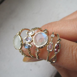 Marina phoenix Ring with morganite, pink tourmaline and smoky quartz on woman's finger.