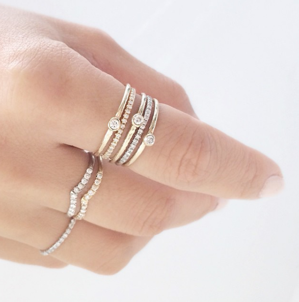 Yellow and White Gold Mini Beak Ring with diamonds on woman's hand.