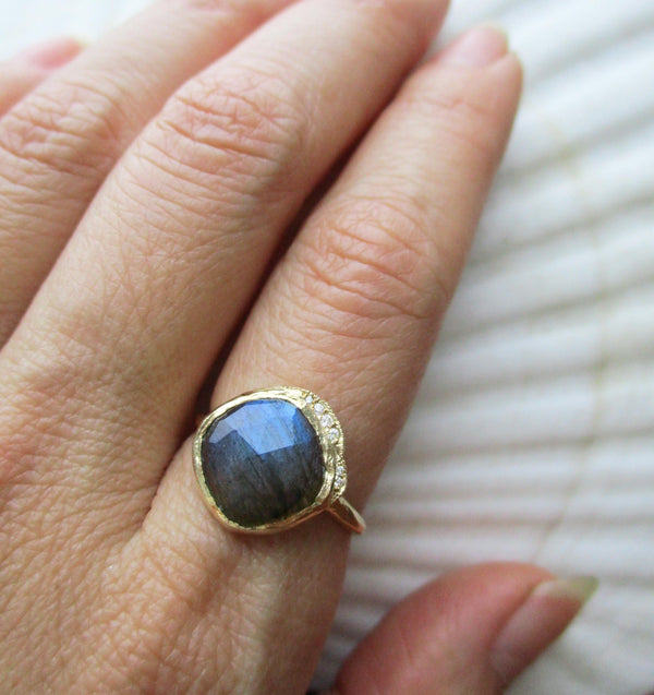 Gold middle cove labradorite ring and a twinkling strip of pavé set diamonds.