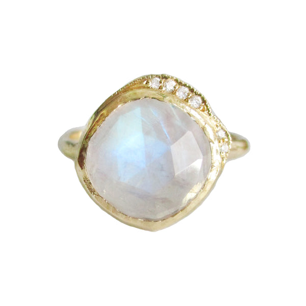 Middle cove moonstone ring with a twinkling strip of white round brilliant diamonds.