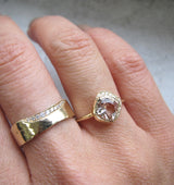 Mini cove morganite ring with white round brilliant diamonds.